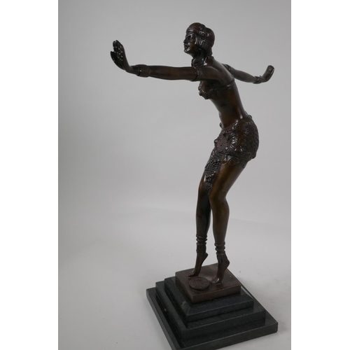 39 - An Art Deco style figurine of a dancing girl, after Preis, on a stepped base, 16½