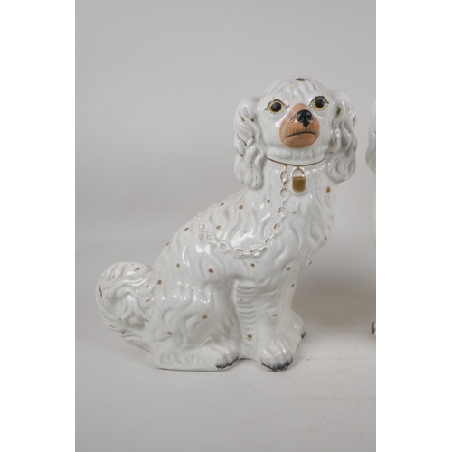 4 - A pair of C19th white & gilt Staffordshire dogs, 12½