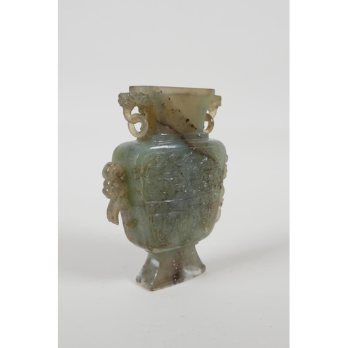 40 - A Chinese celadon nephrite vase/flask with carved dragon decoration & handles, 4½