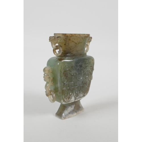 40 - A Chinese celadon nephrite vase/flask with carved dragon decoration & handles, 4½