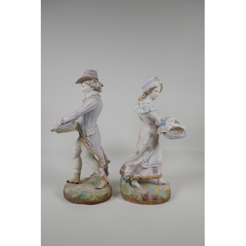 43 - A pair of Royal Dux ceramic figures carrying baskets, mark to base, 14