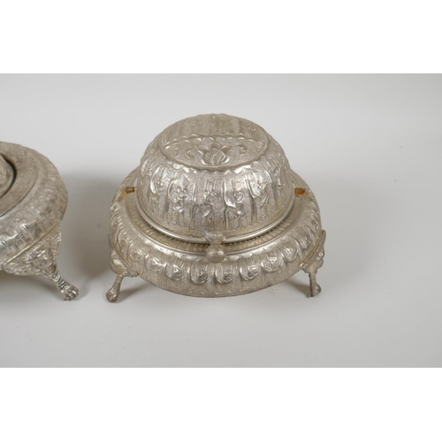 50 - An Indo Persian white metal sweet meat & bonbon dish, with raised figural decoration & tripo... 