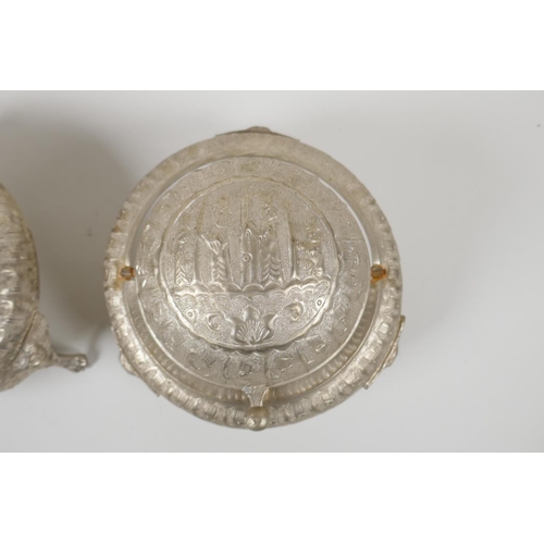 50 - An Indo Persian white metal sweet meat & bonbon dish, with raised figural decoration & tripo... 