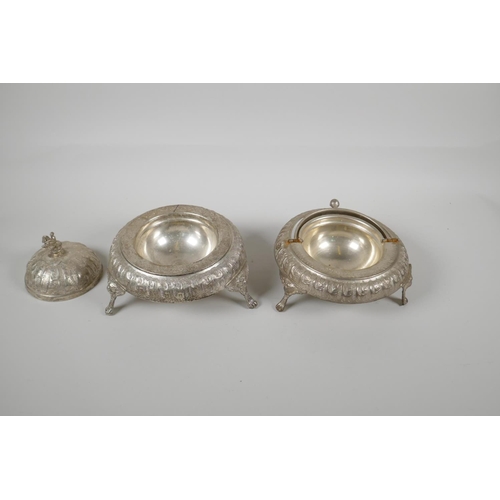 50 - An Indo Persian white metal sweet meat & bonbon dish, with raised figural decoration & tripo... 