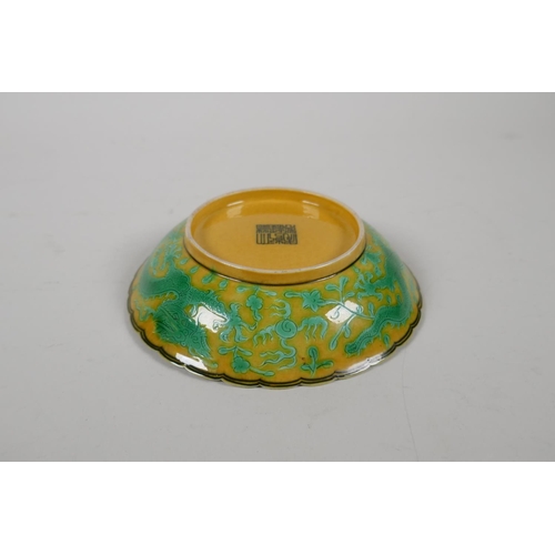 52 - A yellow ground porcelain dish with frilled rim and incised green dragon decoration, Chinese Qianlon... 