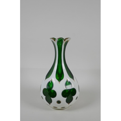 55 - A Bohemian overlaid green glass vase with gilt details, 8½