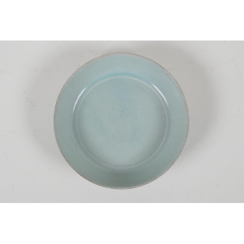 59 - A Chinese celadon Ru ware style porcelain dish, engraved character inscription to base, 5½