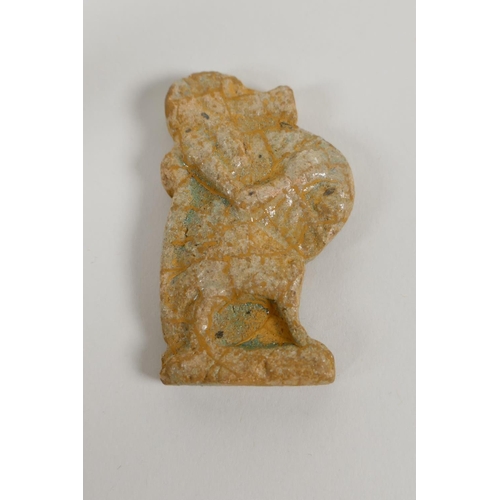 60 - An Egyptian Faience pottery Shabti and a pottery amulet of Khum, 3½