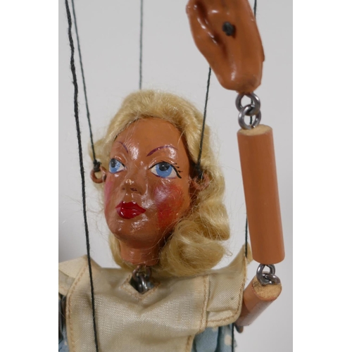 61 - An Alice in Wonderland Pelham Puppet in original box, and a girl's doll with a wire frame, puppet 11... 