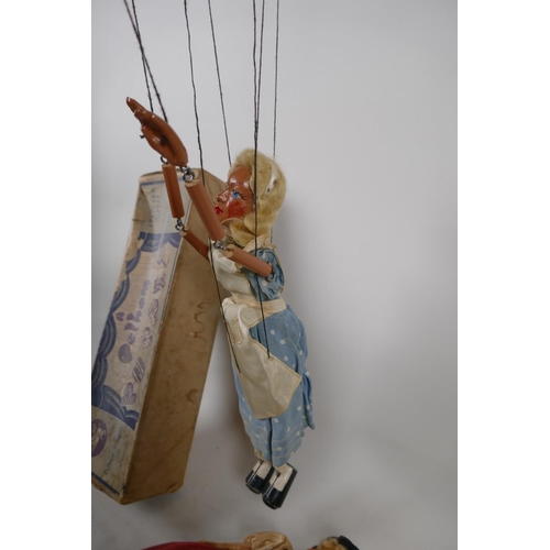 61 - An Alice in Wonderland Pelham Puppet in original box, and a girl's doll with a wire frame, puppet 11... 