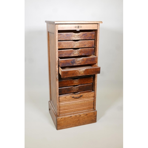 1137 - A tambour front oak filling cabinet, AF, lacks key & bottom drawer. 19