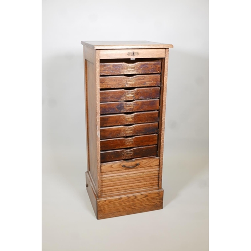 1137 - A tambour front oak filling cabinet, AF, lacks key & bottom drawer. 19