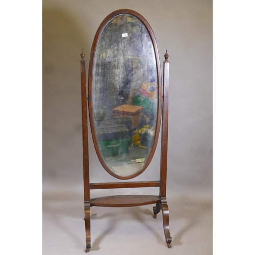 1138 - A Victorian mahogany cheval mirror with original bevelled glass, raised on cabriole supports with br... 