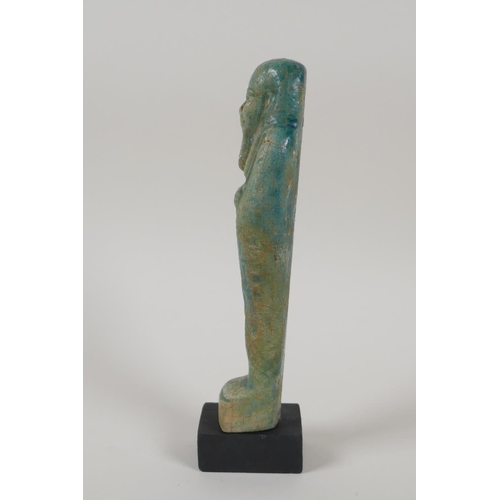 21 - An Egyptian turquoise glazed faience shabti, 7½