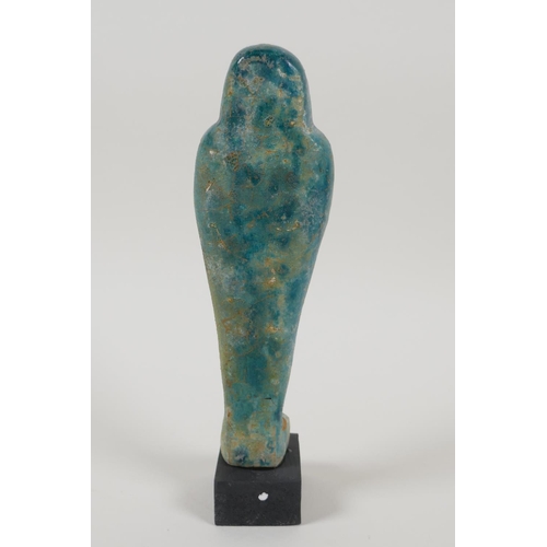 21 - An Egyptian turquoise glazed faience shabti, 7½