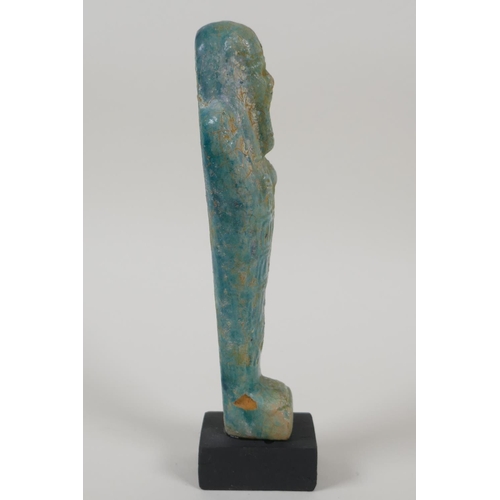 21 - An Egyptian turquoise glazed faience shabti, 7½