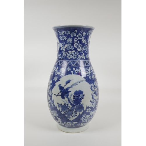 33 - An early C20th Chinese blue and white porcelain vase with two decorative panels depicting birds and ... 