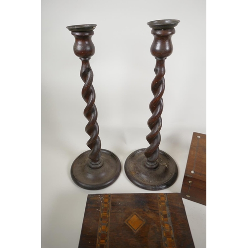 34 - A pair of barley twist oak candlesticks, 15