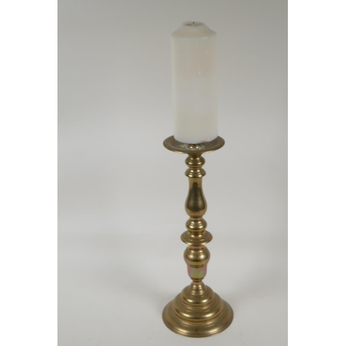 36 - An ecclesiastical turned brass pricket candlestick, 15