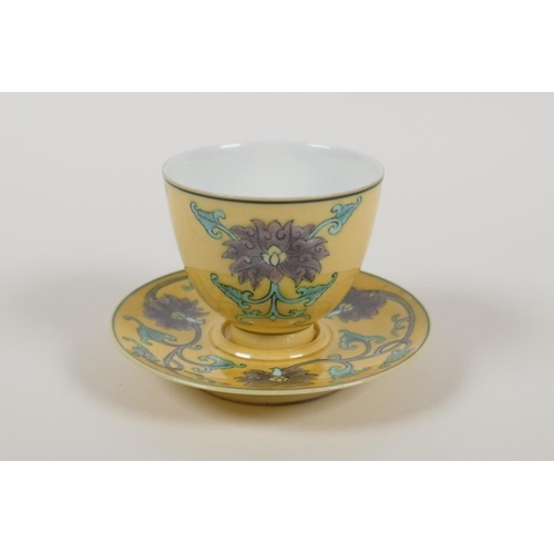 38 - A Chinese Sancai glazed porcelain tea cup and saucer with lotus flower decoration, Kangxi 6 characte... 