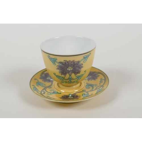 38 - A Chinese Sancai glazed porcelain tea cup and saucer with lotus flower decoration, Kangxi 6 characte... 