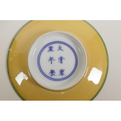 38 - A Chinese Sancai glazed porcelain tea cup and saucer with lotus flower decoration, Kangxi 6 characte... 