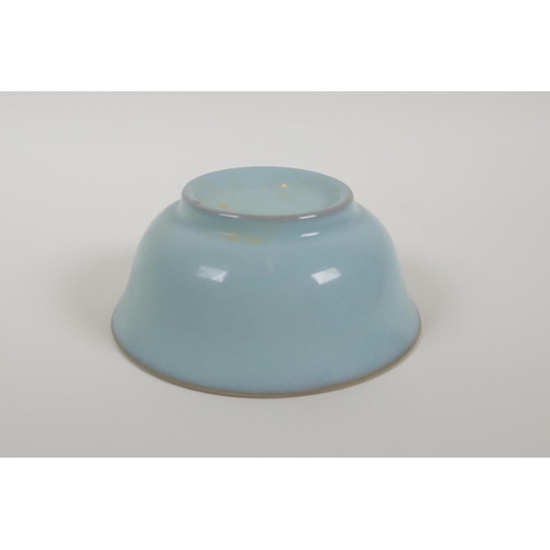 43 - A Chinese celadon Ru ware style porcelain rice bowl, 5½