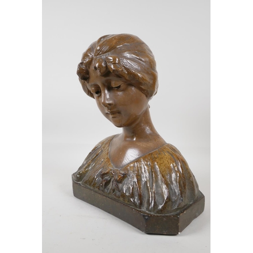 47 - A glazed terracotta bust of a girl in a shawl, 12 high