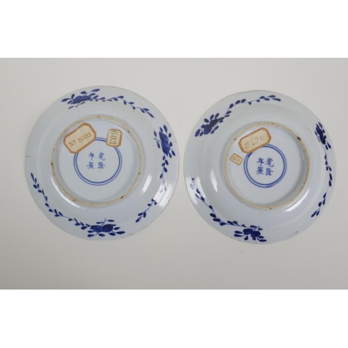 48 - A pair of blue and white porcelain cabinet dishes decorated with figures in a garden, Chinese 4 char... 