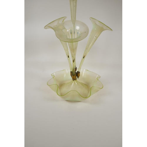 5 - A Victorian vaseline glass epergne with four trumpets, on a petal bowl base, 21