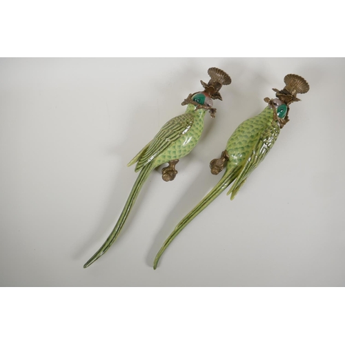 53 - A pair of polychrome porcelain parakeet wall sconces with gilt metal mounts, 18½