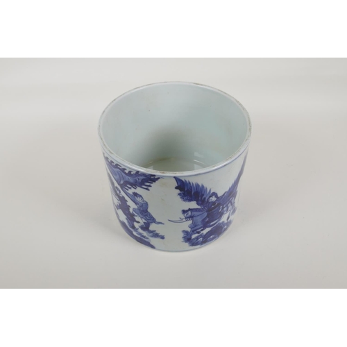 55 - A Chinese blue and white porcelain brush pot decorated with travellers in a landscape, 6 character K... 