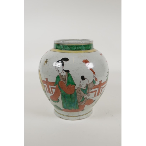 60 - A Chinese Wucai porcelain jar decorated with women and children in a garden, 8½