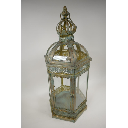 14 - A metal and glass garden lantern, 24