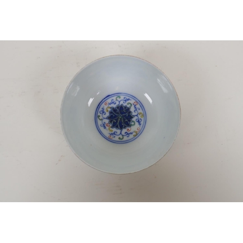 15 - A Chinese polychrome porcelain rice bowl with scrolling lotus flower decoration, early C20th, Guangx... 