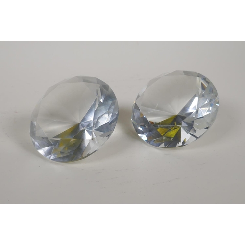 19 - A pair of diamond shaped glass paperweights, 4