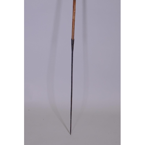 22 - An early C20th African Maasai hunting spear, the tip with double edged leaf point and the butt forme... 