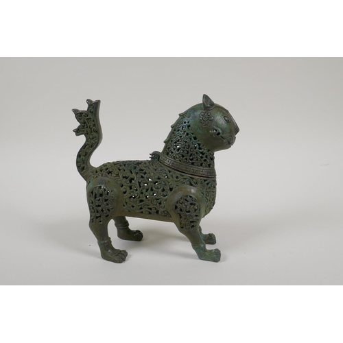 23 - An Indo Persian pierced bronze lion censer, 7