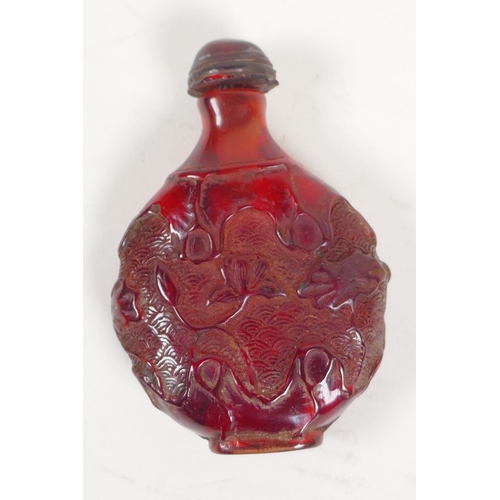 37 - An oriental faux amber snuff bottle with leaf and vine decoration, 3