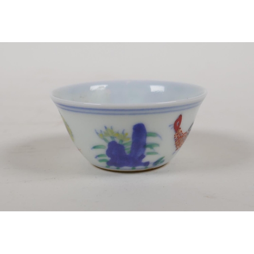 40 - A Ming style doucai porcelain tea bowl with chicken decoration, Chinese 6 character mark to base, 2½... 