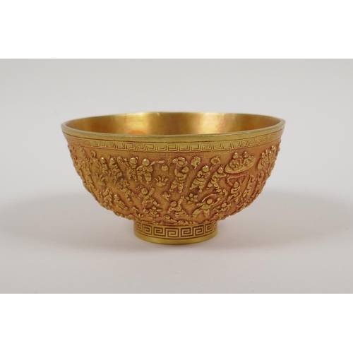 43 - A Chinese gilt metal bowl with raised decoration of the '100 boys', 4 character mark to base, 5