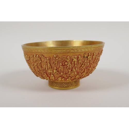 43 - A Chinese gilt metal bowl with raised decoration of the '100 boys', 4 character mark to base, 5