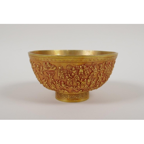 43 - A Chinese gilt metal bowl with raised decoration of the '100 boys', 4 character mark to base, 5