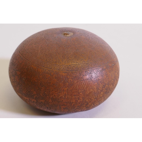 44 - An antique gourd with exceptionally fine engraved decoration, depicting village scenes and farmers t... 