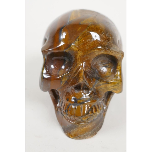 50 - A carved tiger's eye skull, 2½