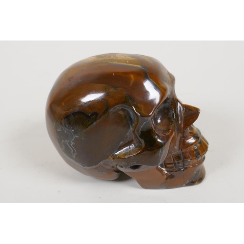 50 - A carved tiger's eye skull, 2½