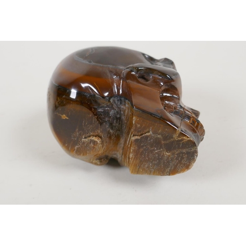 50 - A carved tiger's eye skull, 2½