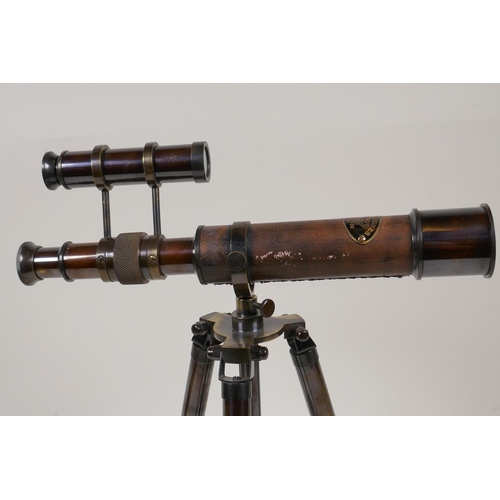 56 - A brass table top telescope on extending tripod stand, 11