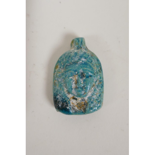 58 - An Egyptian turquoise glazed faience horus shabti and a turquoise glazed pottery head bust token, la... 