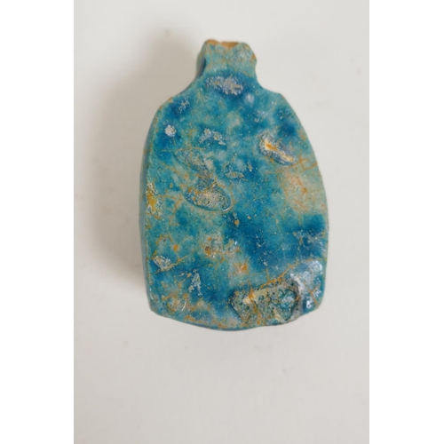 58 - An Egyptian turquoise glazed faience horus shabti and a turquoise glazed pottery head bust token, la... 